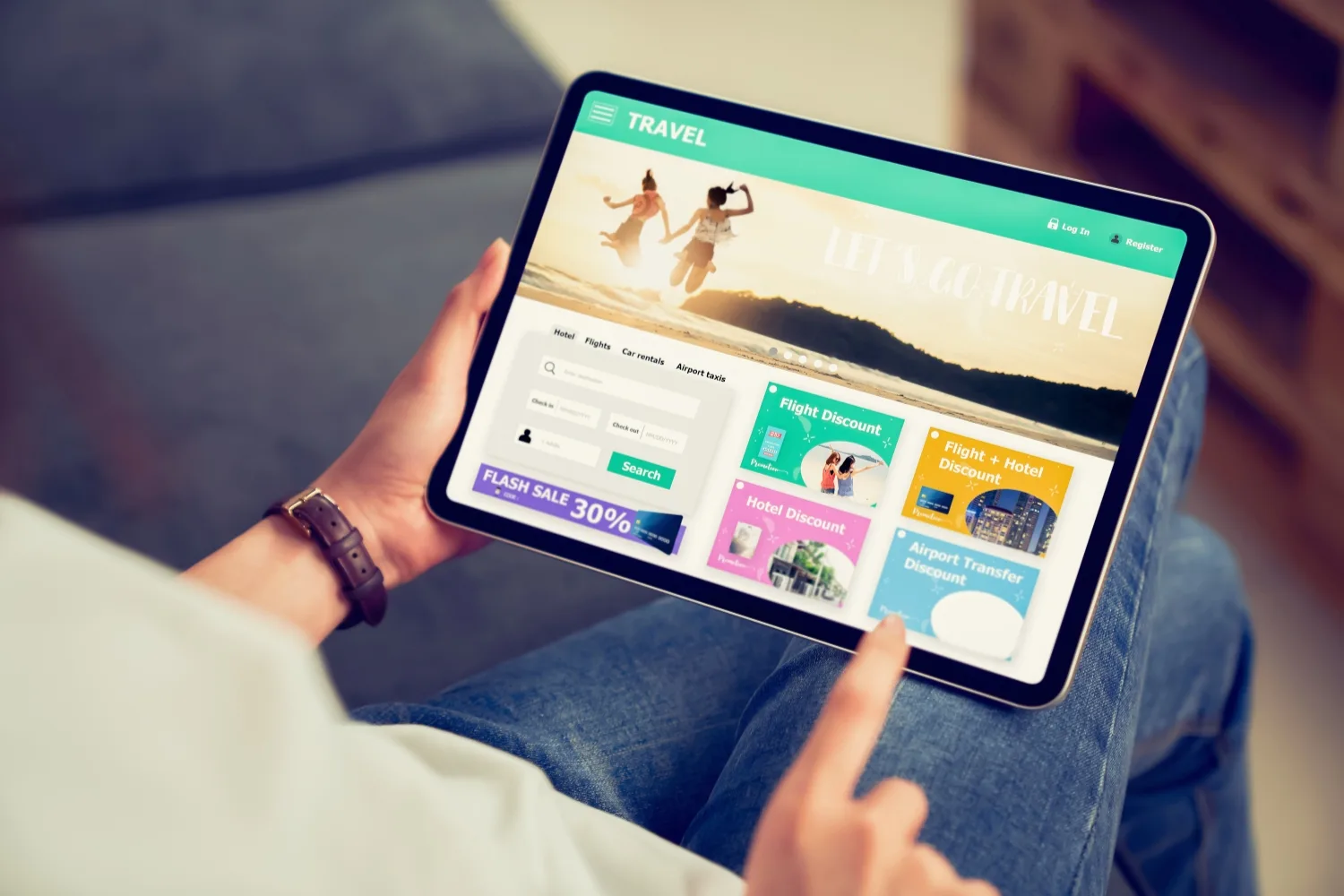 hands holding a tablet and scrolling through a travel personalized website